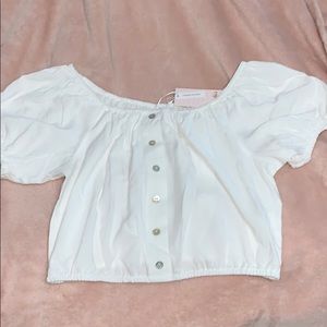 A white off the shoulder crop top
